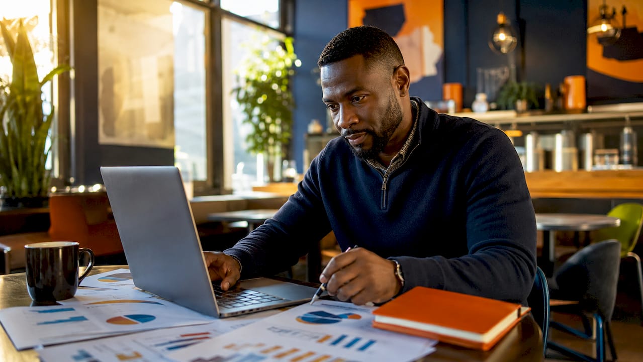 Marketing analyst reviewing dashboards in office