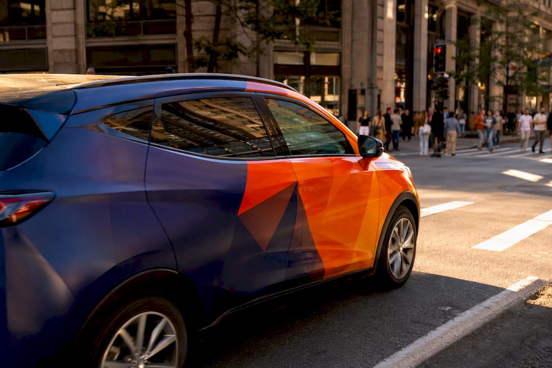 Partially wrapped rideshare vehicle with mobile billboard