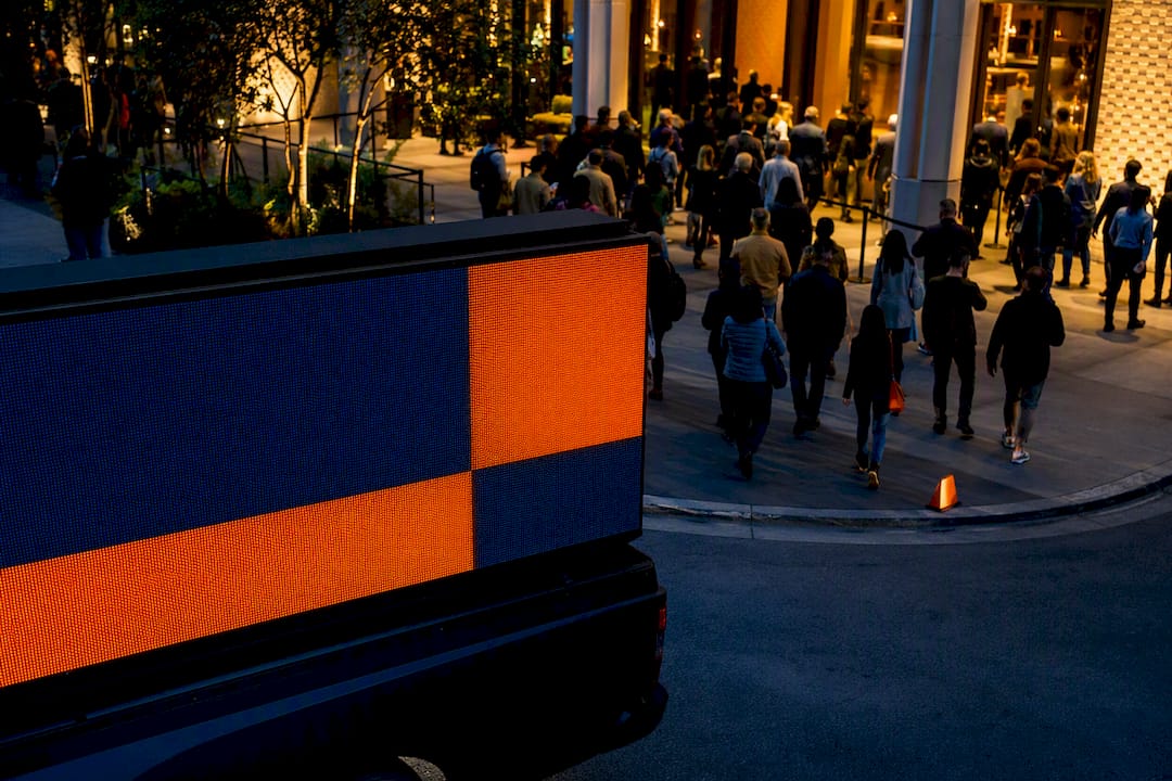 Mobile billboard passing an event district