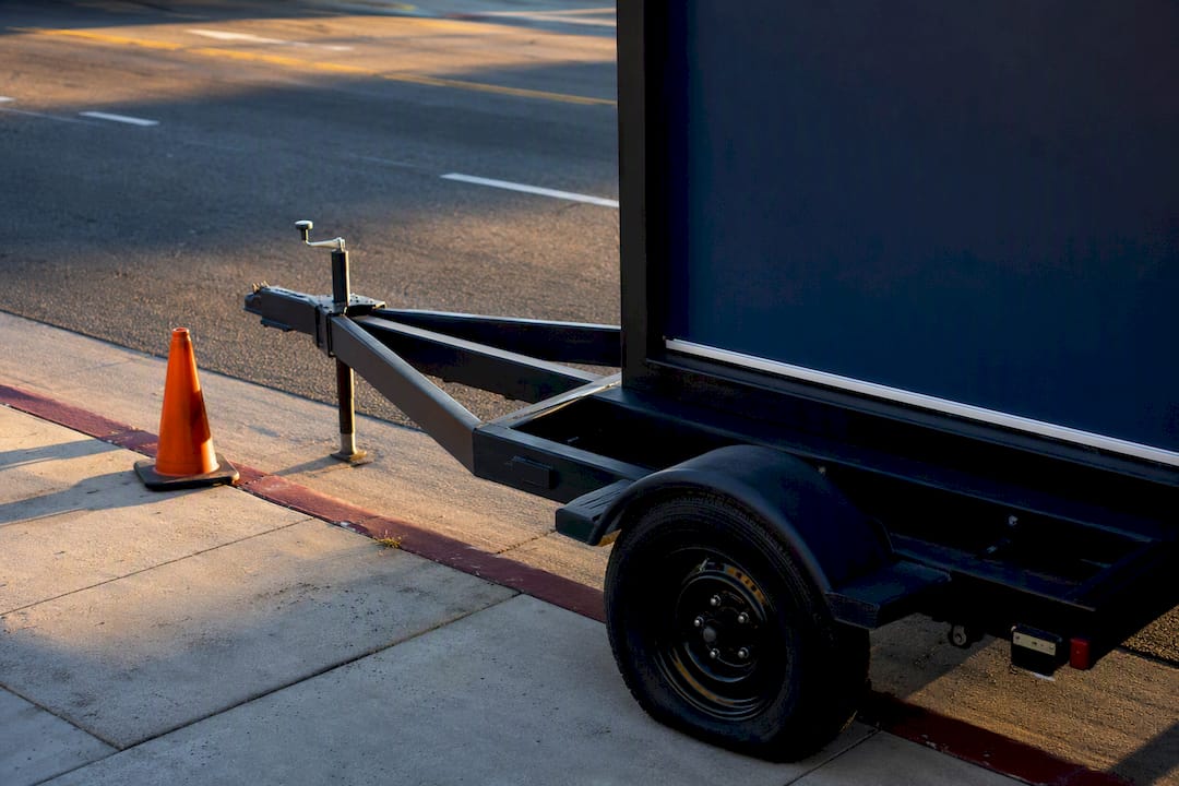 Anonymous mobile billboard parked beside Los Angeles curb